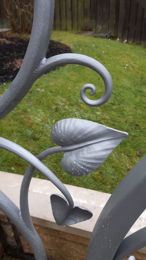Leaf and scroll handrail detail